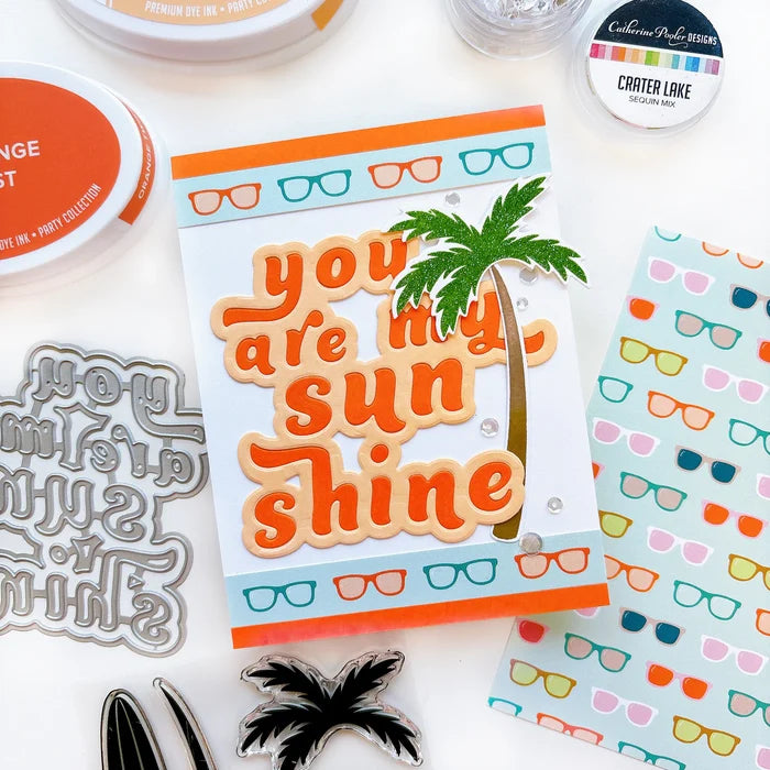 Catherine Pooler - Layered Word Dies - My Sunshine. This word die cuts a frame for the phrase "you are my sunshine" that can be used open or with the letters inlaid back inside for more color contrast. Available at Embellish Away located in Bowmanville Ontario Canada. Example by Catherine Pooler Designs.