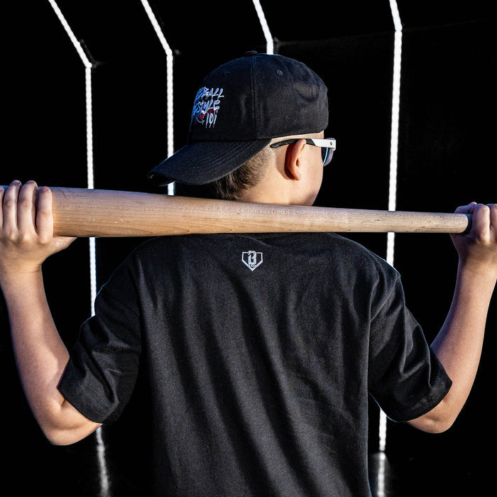 Youth model wearing black youth graphic tee with "Chicago White Sox Upside Down" design