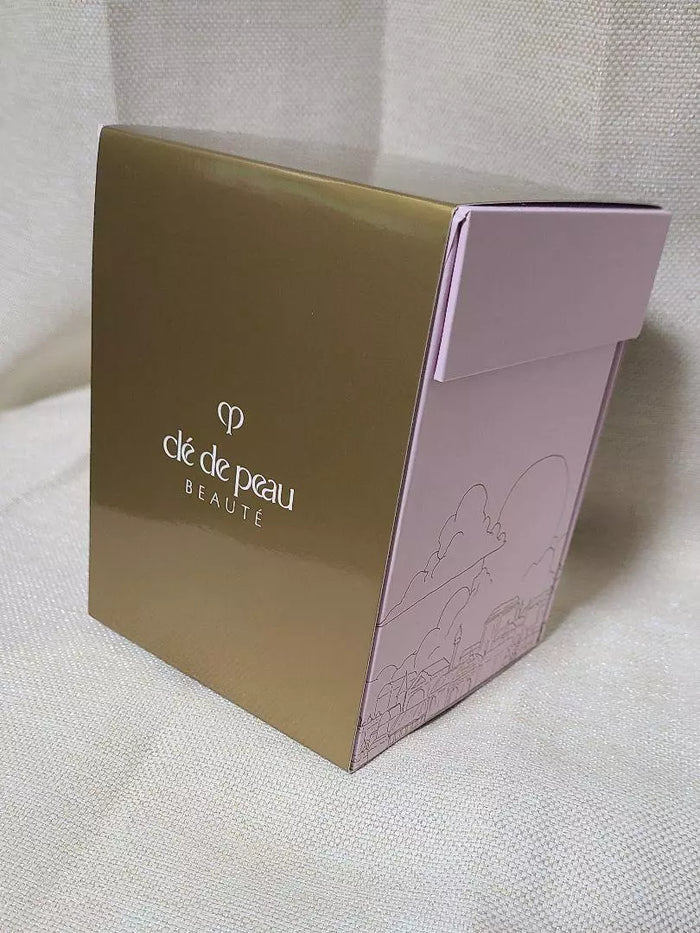 Clé de Peau Beauté Holiday Limited Edition Snow Globe, NIB, decorative home ornament with festive design and elegant branding.