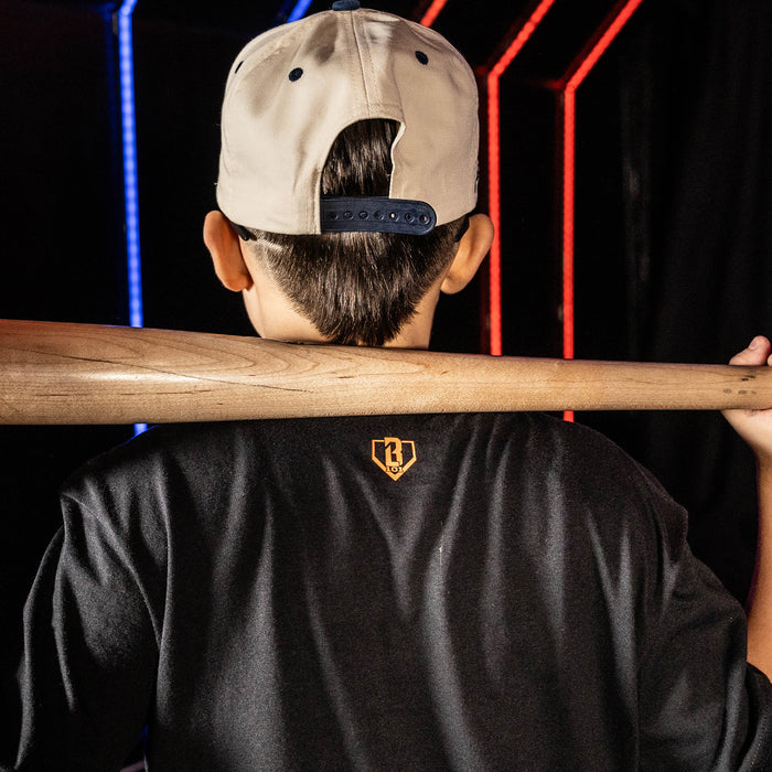 Youth model wearing black youth graphic tee with "Detroit Tigers Upside Down" design