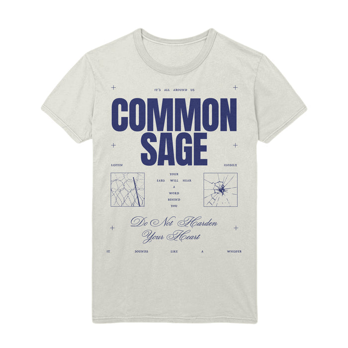 On a white T-shirt the words "Common Sage" are in the center in dark blue. Above these letters are the words "it's all around us" and below "Do Not Harden Your Heart". Tiny blue crosses are around the shirt.