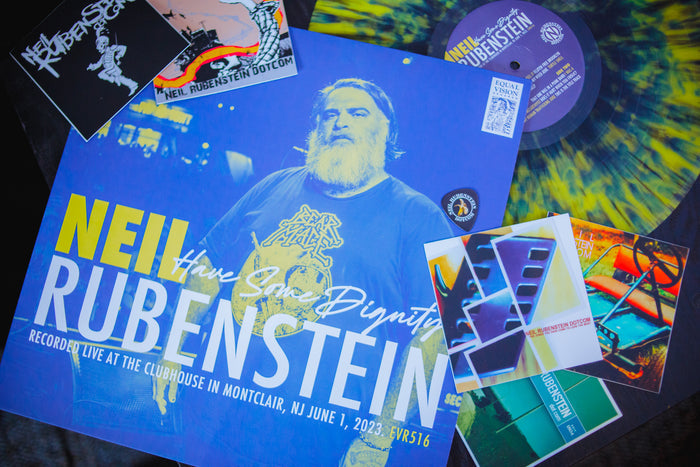 This image shows the Neil Rubenstein vinyl and jackets spread out over a dark table.