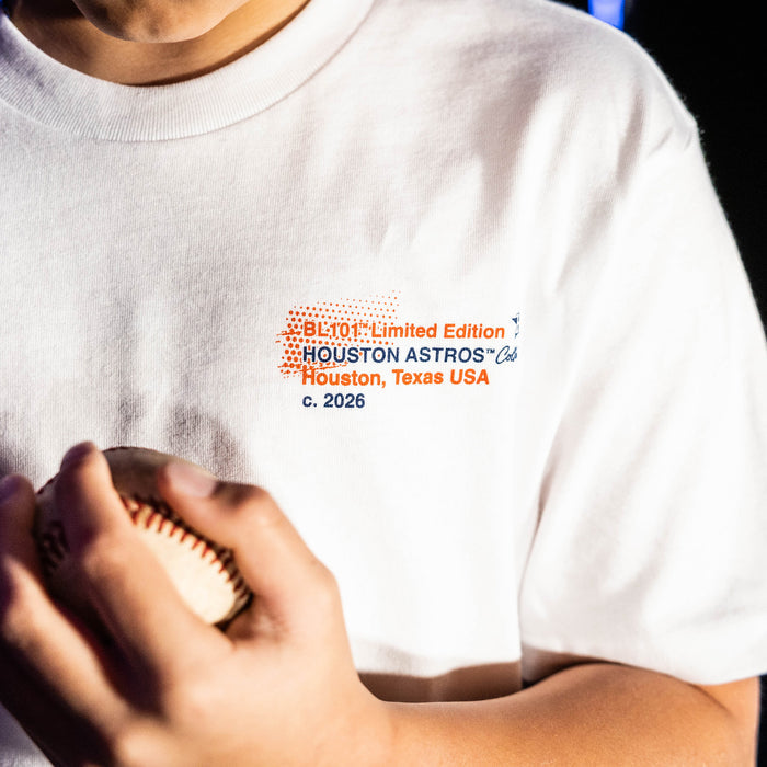 Youth model wearing white youth graphic tee with "Houston Astros Drip" design