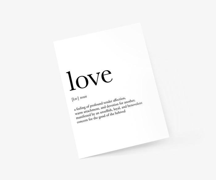 lifestyle shot of a valentine’s day card with the word “love” in black handwriting and it's definition