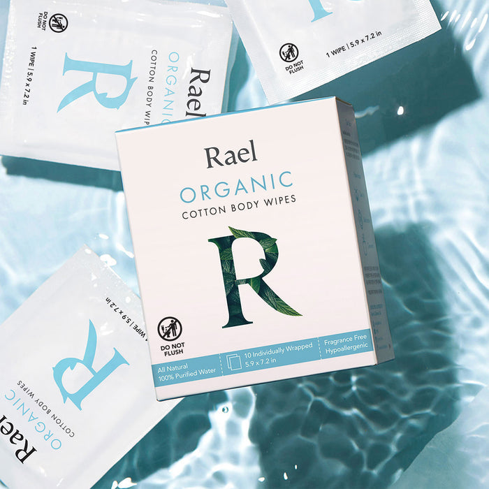 Rael Organic Cotton Body Wipes on a water background.