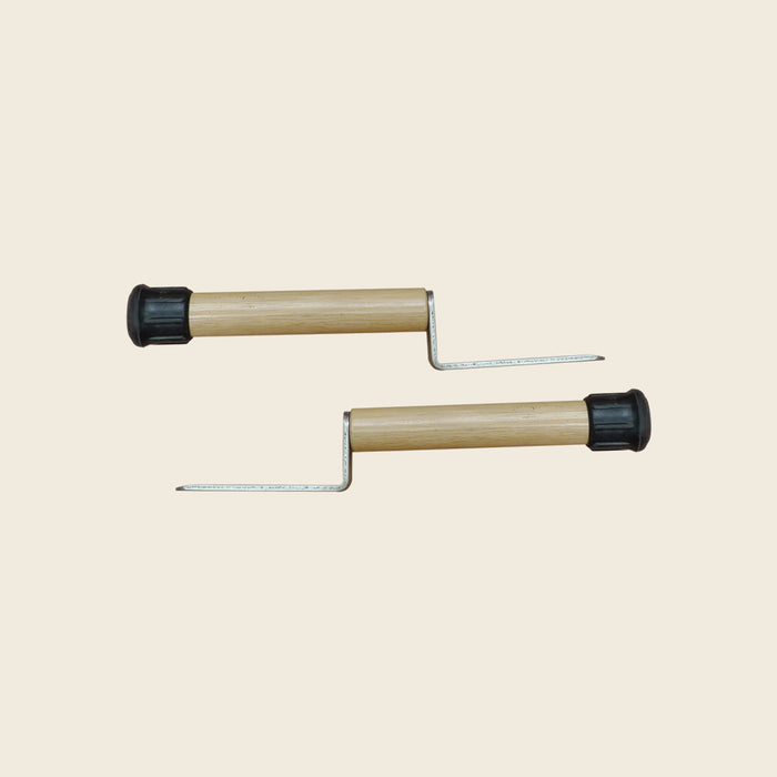 Pair of wooden raised insert handles with metal insert prongs for Pilates low mats.