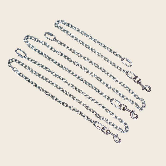 Three galvanized steel safety chains with snap hooks and quick links for a studio wall unit.