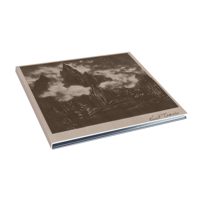 The CD cover has a sketch of mountains in the clouds in black and white with the words "Kurt Travis" on the bottom right of the cover.