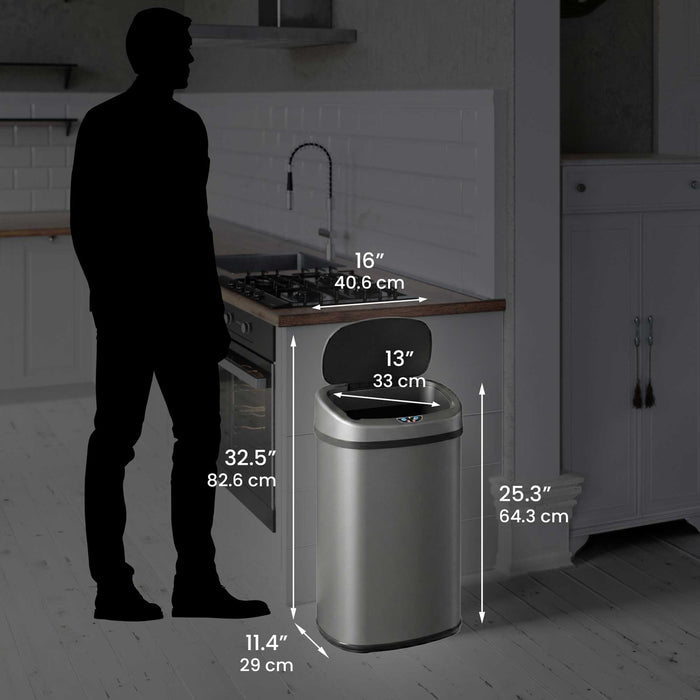 Size perspective image of the iTouchless ITOS13GY trash can next to a silhouette of a person, displaying its full dimensions in inches and centimeters (25.3" height with lid open).
