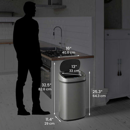 Size perspective image of the iTouchless ITOS13GY trash can next to a silhouette of a person, displaying its full dimensions in inches and centimeters (25.3" height with lid open).