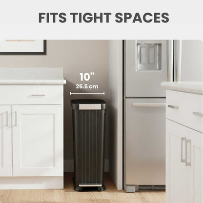 iTouchless PE13BB slim step trash can fits into tight spots like between refrigerator and counter in the kitchen