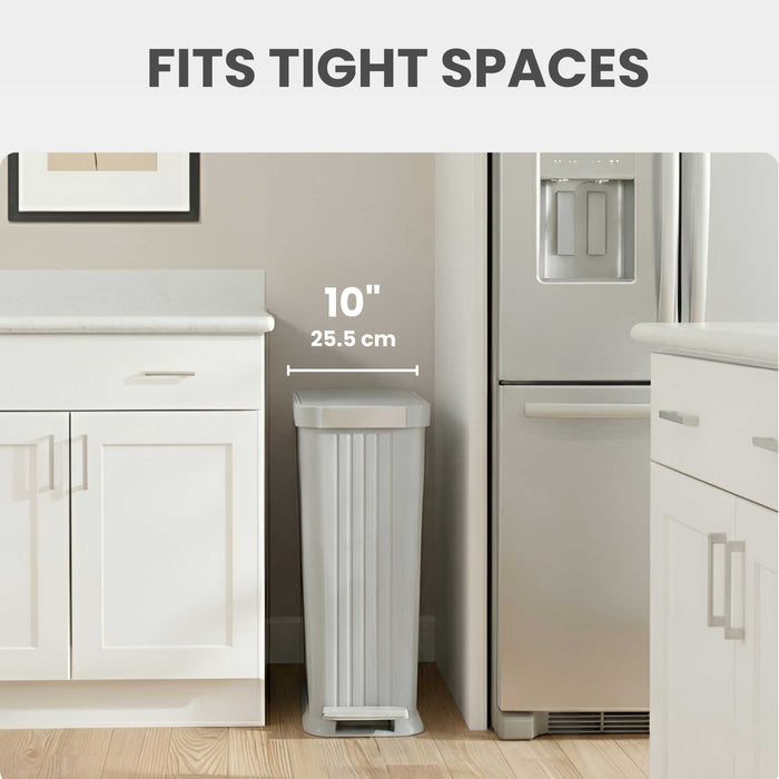 iTouchless PE13OO slim step trash can fits into tight spots like between refrigerator and counter in the kitchen