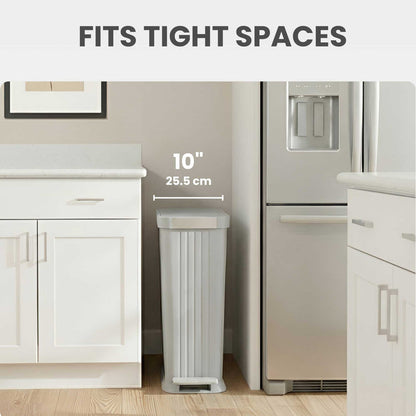 iTouchless PE13OO slim step trash can fits into tight spots like between refrigerator and counter in the kitchen