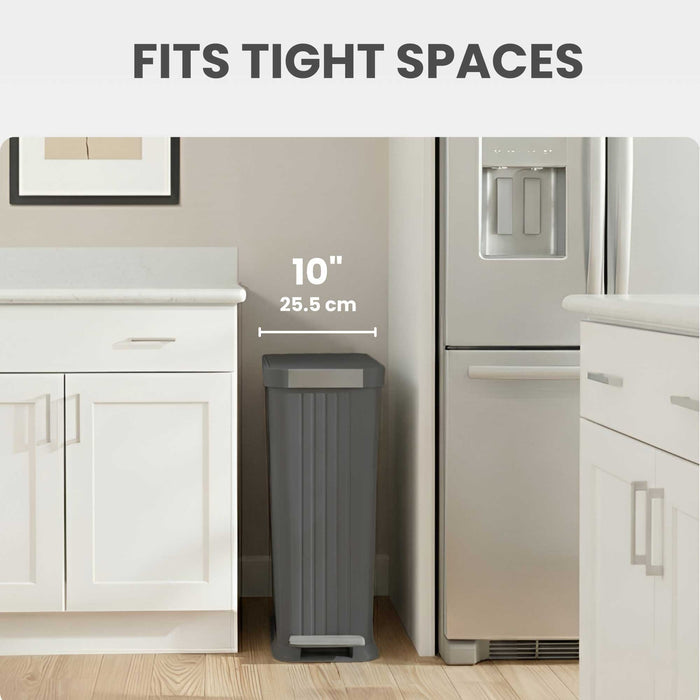 iTouchless PE13GG slim step trash can fits into tight spots like between refrigerator and counter in the kitchen