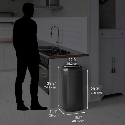 Size perspective image of the iTouchless OL16STVBK trash can next to a silhouette of a person, displaying its full dimensions in inches and centimeters (29.2" height with lid open).