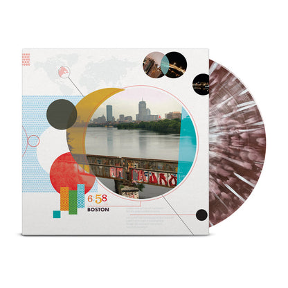 Maroon vinyl with white splatter peaking out of white square jacket. Jacket has the words "6:58pm Boston" on it with various red, black, and gray circles. The biggest circle contains a picture of the city from the view of a lake.