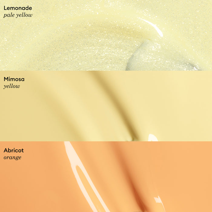 Three glossy, gel-like horizontal swatches: pale yellow labeled Lemonade, light yellow labeled Mimosa, and pastel apricot orange labeled Abricot by Manucurist, each with its color name in the corner.