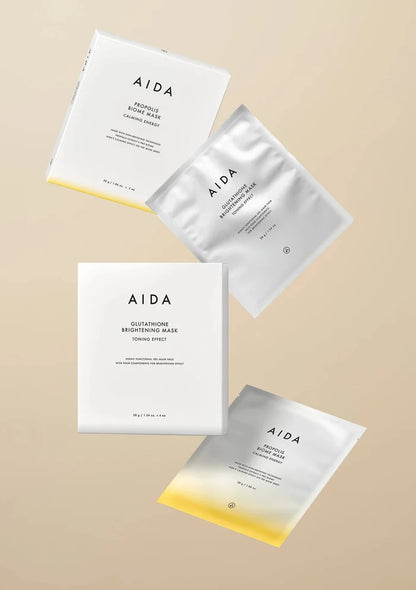 AIDA skincare masks on a beige background