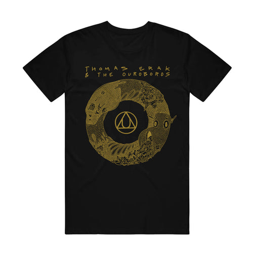 A black short sleeve t shirt has an image of a yellow ouroboros with the Au gold symbol in the center. At the top, yellow words say "Thomas Erak & The Ouroboros".