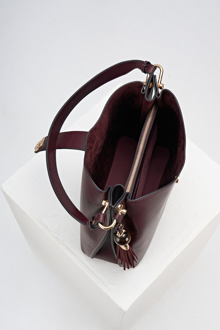 Overhead view of Andrea Black Cherry faux leather Hobo shoulder bag showing the inside of the bag and the internal pockets