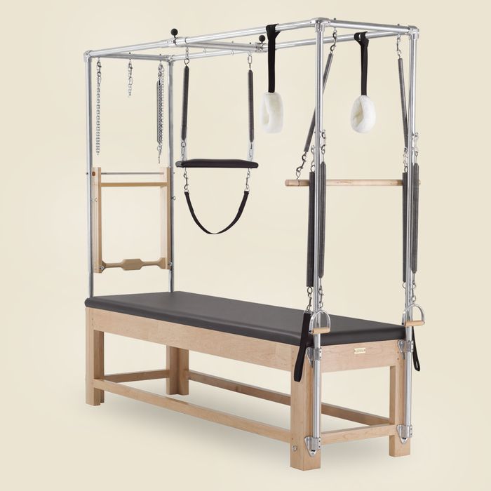 Pair of Pilates springs and straps mounted on a wooden-frame Gratz Cadillac apparatus.