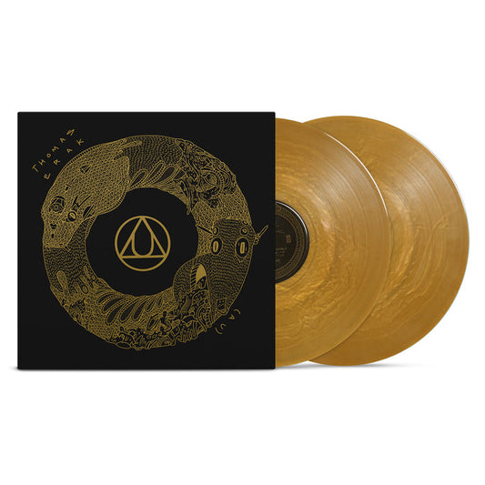 A Limited Edition release from Thomas Erak & The Ouroboros: two translucent Gold Nugget LPs partially pulled from a black cover adorned with intricate gold circular artwork and the band’s stylized name.