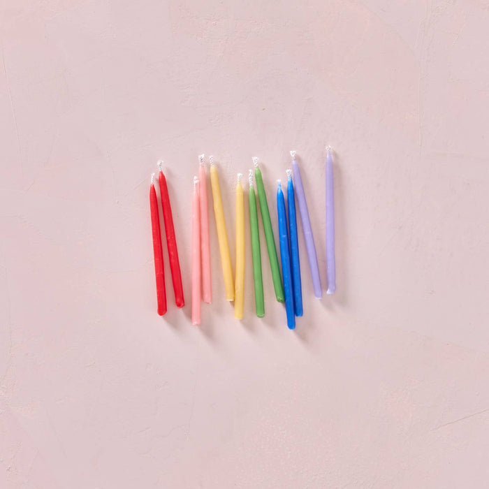 Multicolor beeswax party candles, slender rainbow tapers with white wicks