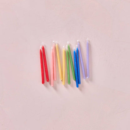 Multicolor beeswax party candles, slender rainbow tapers with white wicks