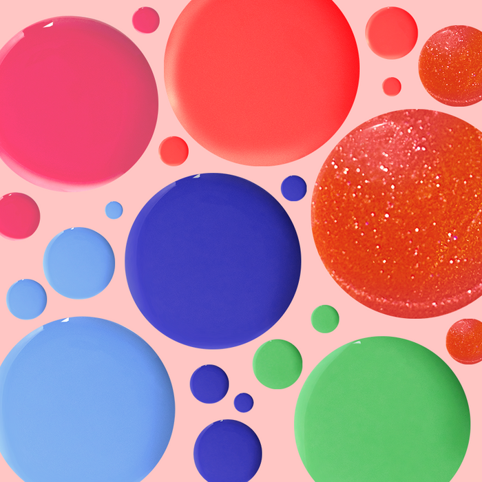 Colorful nail polish drops in bright neon and shimmer shades from the Best of Summer Set for vibrant mani looks