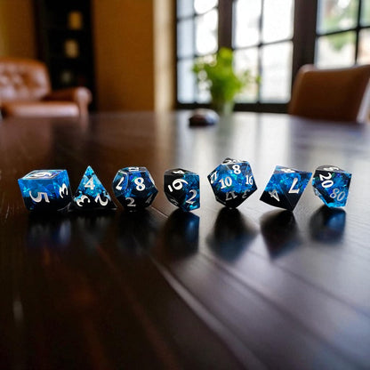 7-piece Black and Blue Prismatic RPG Dice Set with swirling resin and glitter, ideal for cosmic and dark fantasy campaigns.