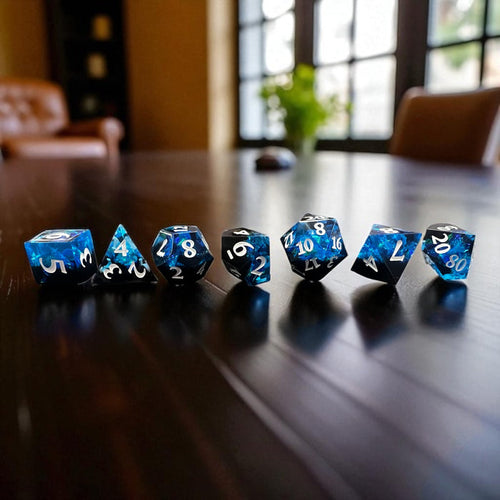 7-piece Black and Blue Prismatic RPG Dice Set with swirling resin and glitter, ideal for cosmic and dark fantasy campaigns.
