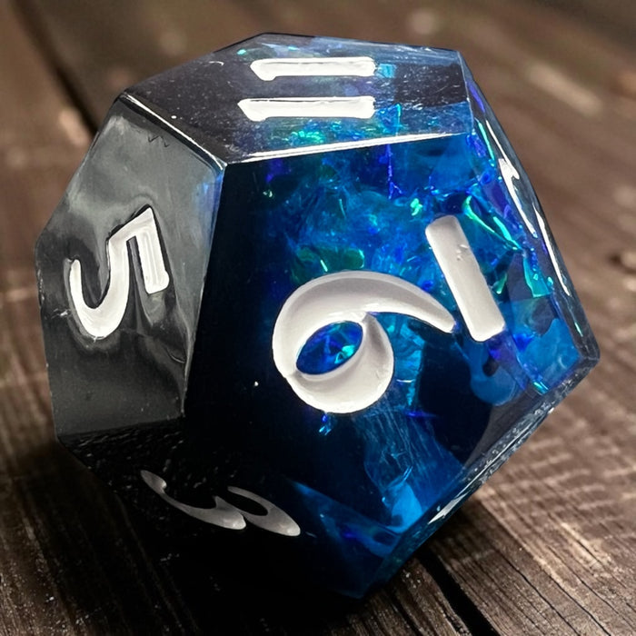 7-piece Black and Blue Prismatic RPG Dice Set with swirling resin and glitter, ideal for cosmic and dark fantasy campaigns.