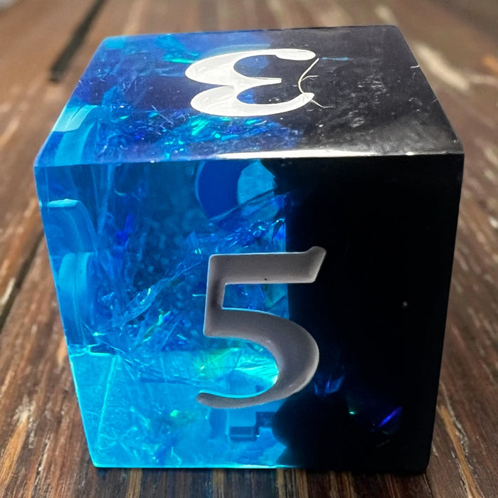7-piece Black and Blue Prismatic RPG Dice Set with swirling resin and glitter, ideal for cosmic and dark fantasy campaigns.