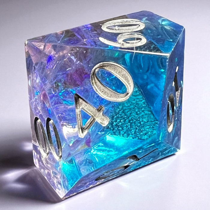 7-piece Blue and Purple Prismatic Dice Set with swirling resin and white numbering, designed for DnD and fantasy RPGs.