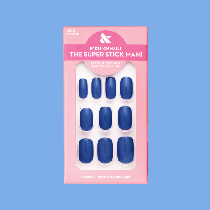 Bootcut | Short | Squoval - Tab Press-On nails in deep denim blue shade with non-damaging tabs in pink packaging