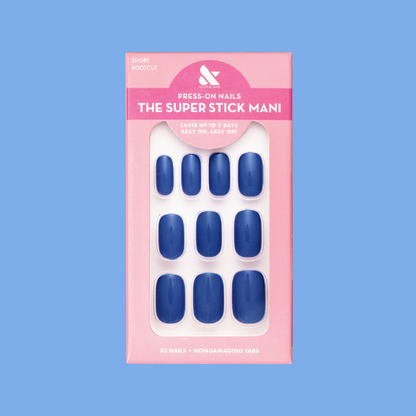 Bootcut | Short | Squoval - Tab Press-On nails in deep denim blue shade with non-damaging tabs in pink packaging
