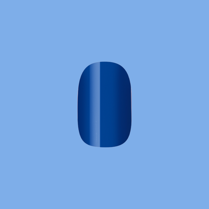 Single deep denim blue nail in short squoval shape from Bootcut | Short | Squoval - Tab Press-On set
