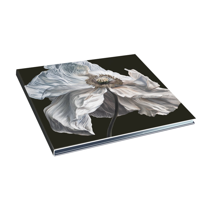A Quicksand hardcover book with a close-up white poppy on a black background is displayed at an angle on a white surface—ideal for fans anticipating the Bring on The Psychics CD and album release in July 2026.