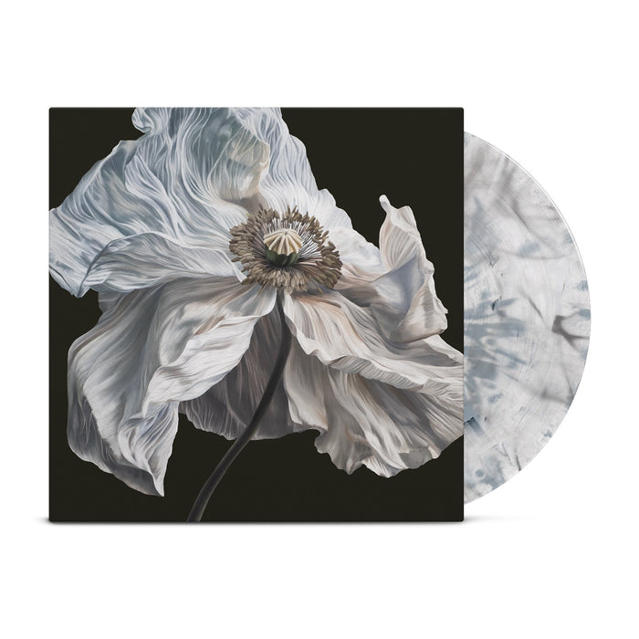 A limited edition LP, the Quicksand Bring On The Psychics vinyl, features a striking blue white dark grey variant with a marbled pattern partially visible next to its sleeve, which displays a close-up illustration of a delicate white flower with ruffled petals set against a dark background.