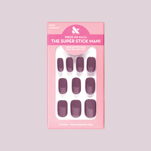 Cardigan | Short | Squoval - Tab Press-On nails in warm mauve shade displayed in pink packaging for easy at-home mani.