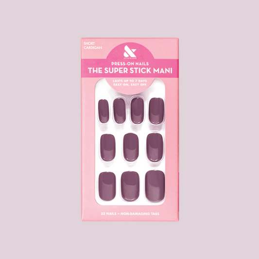 Cardigan | Short | Squoval - Tab Press-On nails in warm mauve shade displayed in pink packaging for easy at-home mani.