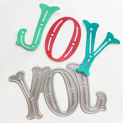 Catherine Pooler - Word Die - Festive Joy. Celebrate the season with the Festive Joy Word Die! This beautiful large "JOY" die can serve as the focal point of your holiday cards, adding a bold and cheerful touch. Available at Embellish Away located in Bowmanville Ontario Canada.