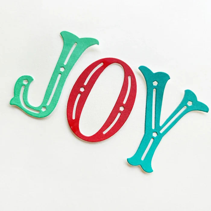 Catherine Pooler - Word Die - Festive Joy. Celebrate the season with the Festive Joy Word Die! This beautiful large "JOY" die can serve as the focal point of your holiday cards, adding a bold and cheerful touch. Available at Embellish Away located in Bowmanville Ontario Canada.