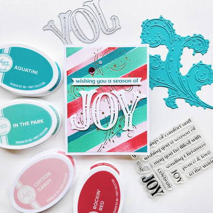 Catherine Pooler - Word Die - Festive Joy. Celebrate the season with the Festive Joy Word Die! This beautiful large "JOY" die can serve as the focal point of your holiday cards, adding a bold and cheerful touch. Available at Embellish Away located in Bowmanville Ontario Canada. Example by Catherine Pooler Designs.