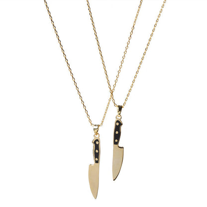 Yellow Owl Workshop chef's knife necklace, a detailed jewelry piece featuring a miniature chef's knife pendant on a chain.