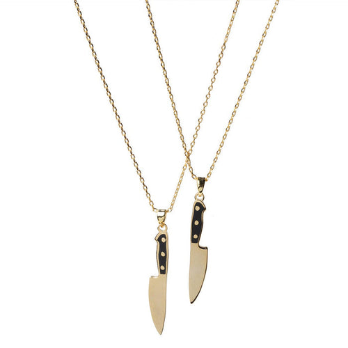 Yellow Owl Workshop chef's knife necklace, a detailed jewelry piece featuring a miniature chef's knife pendant on a chain.