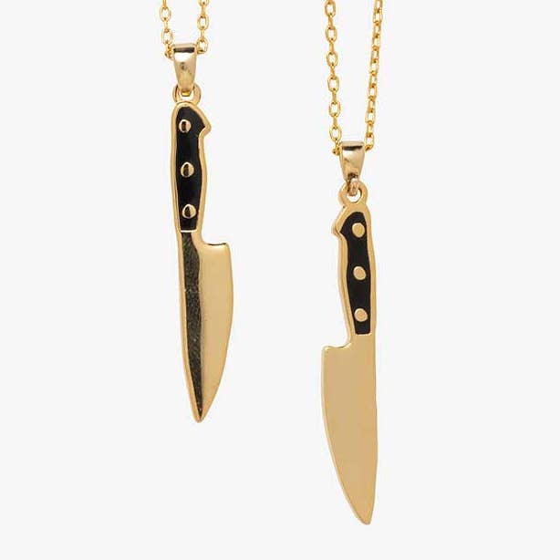 Yellow Owl Workshop chef's knife necklace, a stylish jewelry piece featuring a detailed knife pendant on a chain.