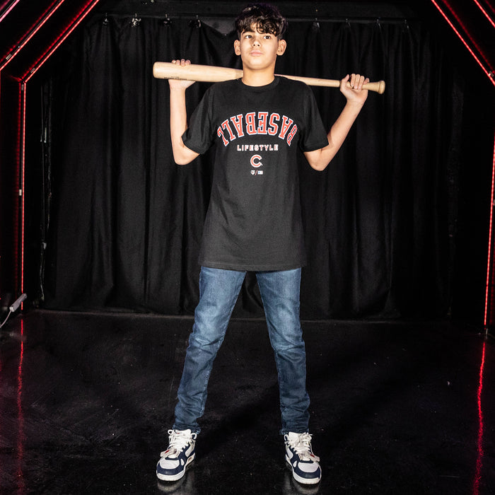 Youth model wearing black youth graphic tee with "Chicago Cubs Upside Down" design