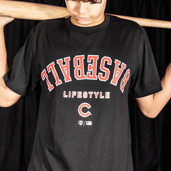 Youth model wearing black youth graphic tee with "Chicago Cubs Upside Down" design