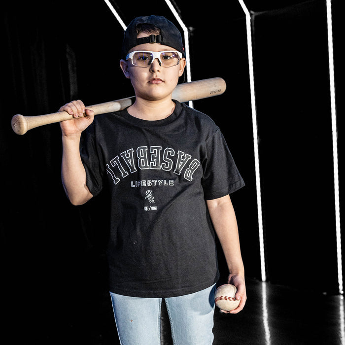 Youth model wearing black youth graphic tee with "Chicago White Sox Upside Down" design